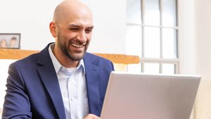 Smiling Man Blue Suit Laptop Screen