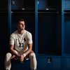 Soccer Player White Uniform Blue Lockers