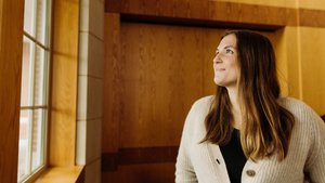 Woman Beige Cardigan Looking Out Window